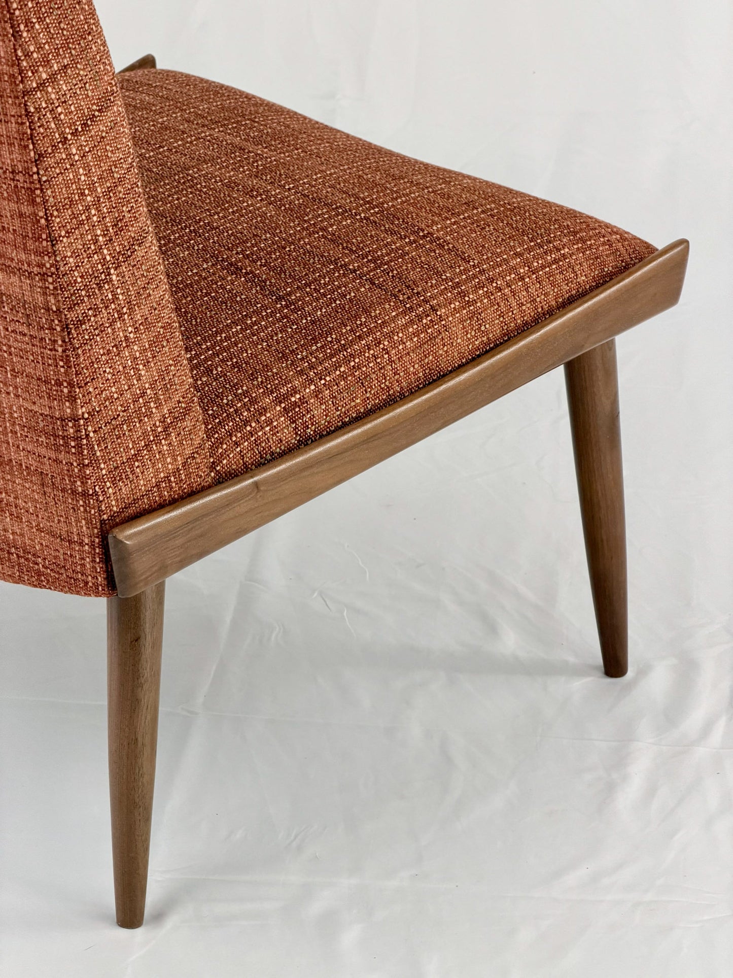 Wooden chair with orange upholstery chair on a white background