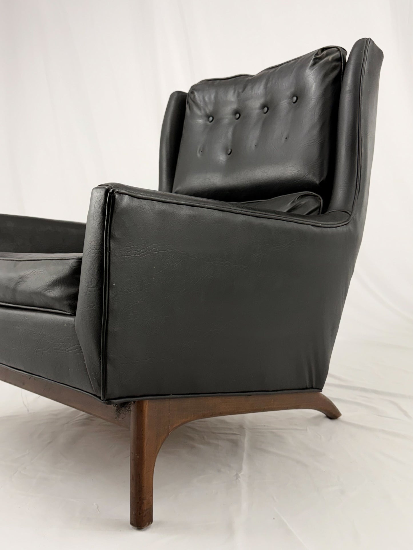 Black leather armchair on a white background