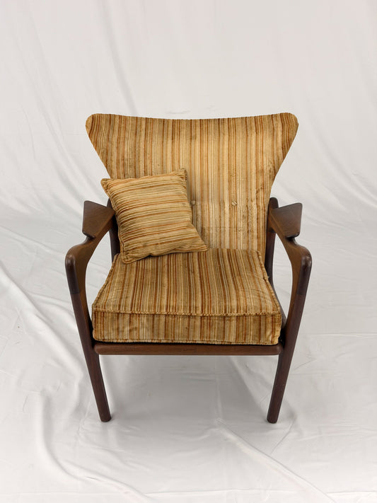 Adrian Pearsall armchair with striped upholstery on a white background