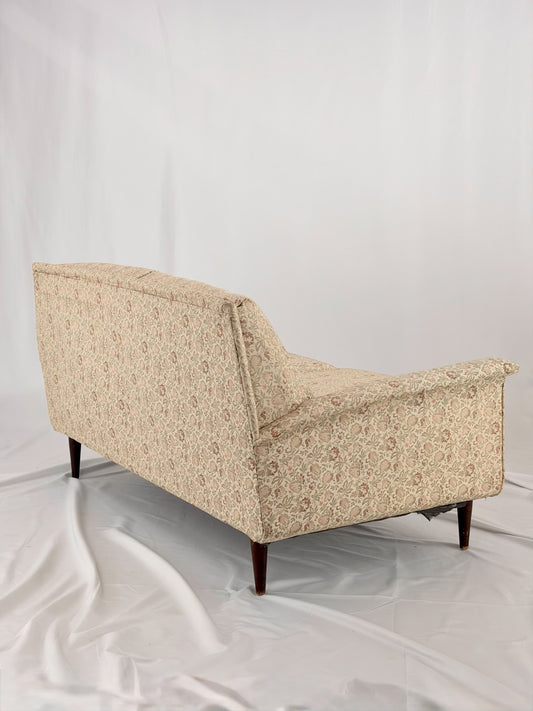 Beige sofa on a white background