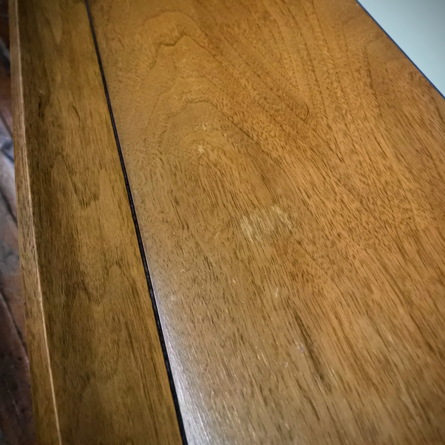 Close-up of a wooden surface with a visible grain pattern