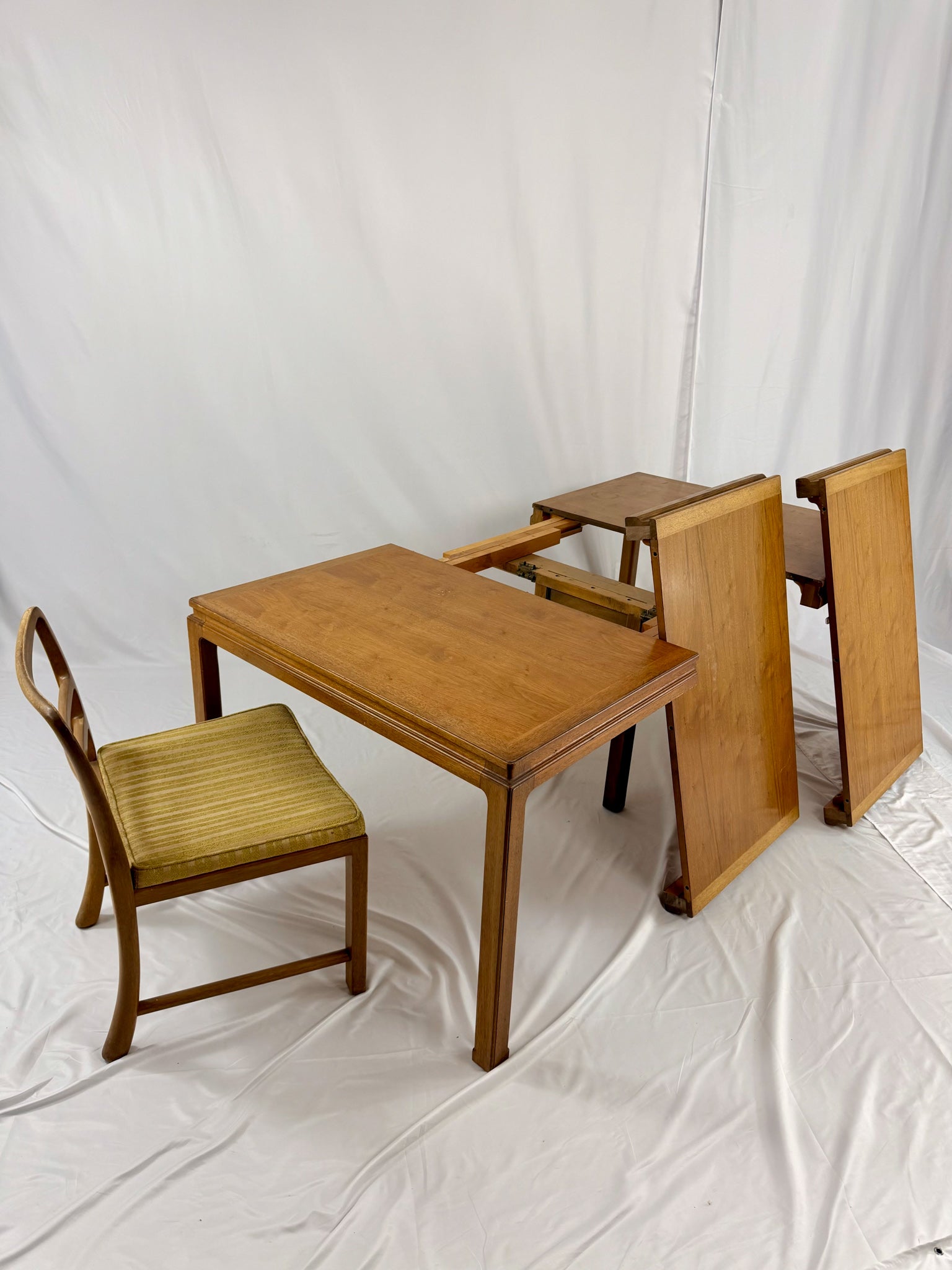 Wooden dining set with table and chairs on a white background