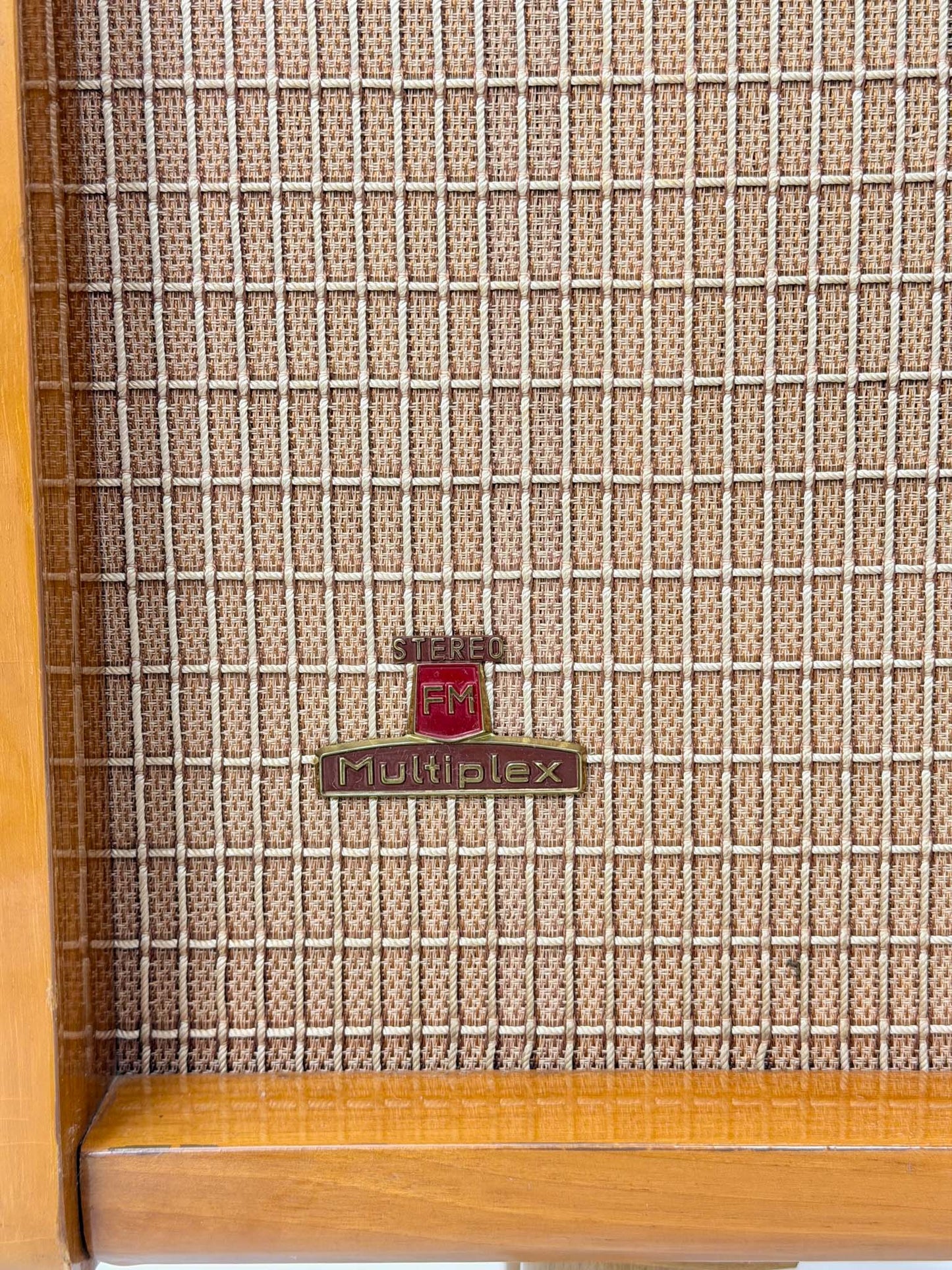 Vintage radio with 'FM Multiplex' branding on a textured surface