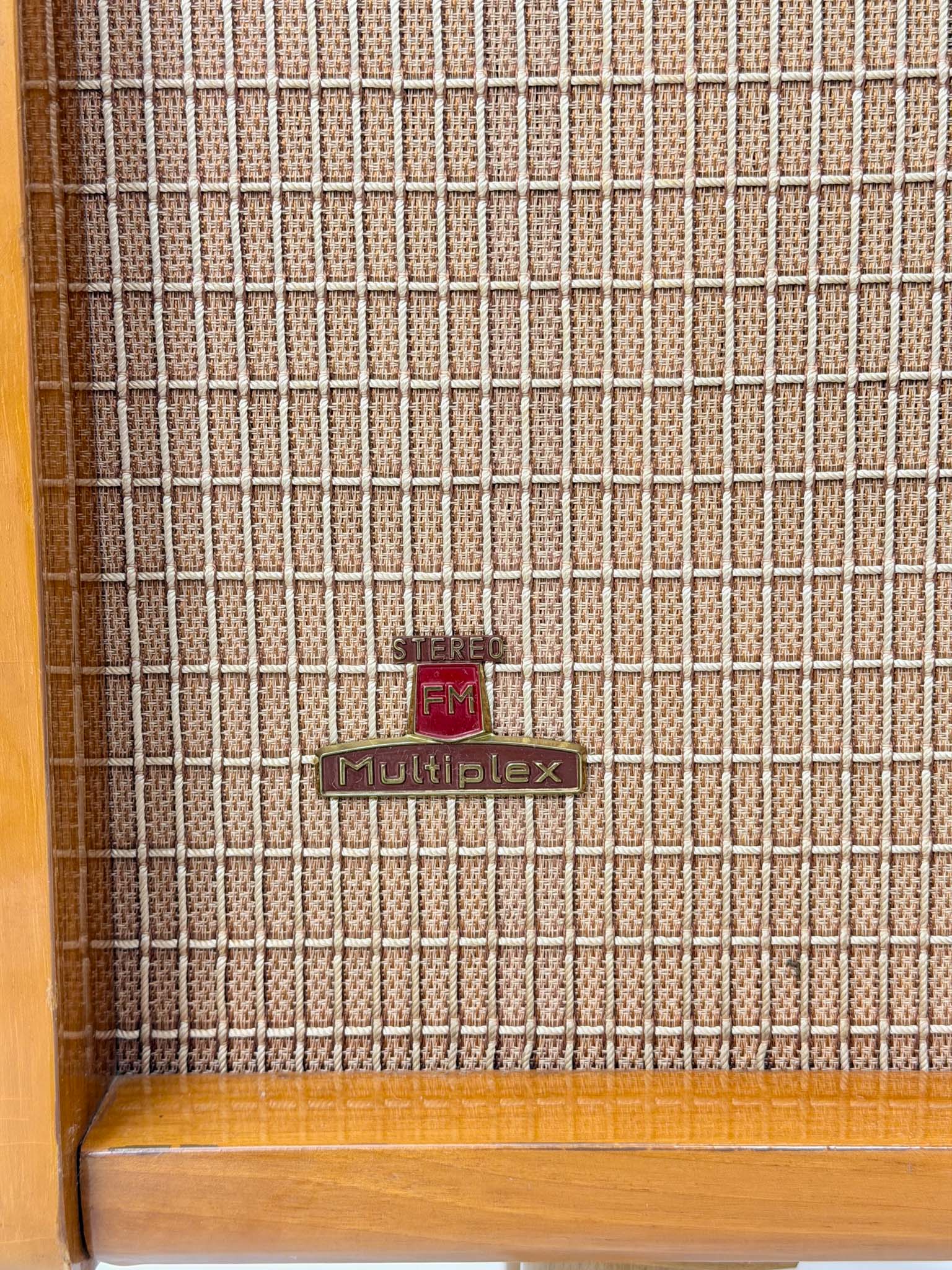 Vintage radio with 'FM Multiplex' branding on a textured surface