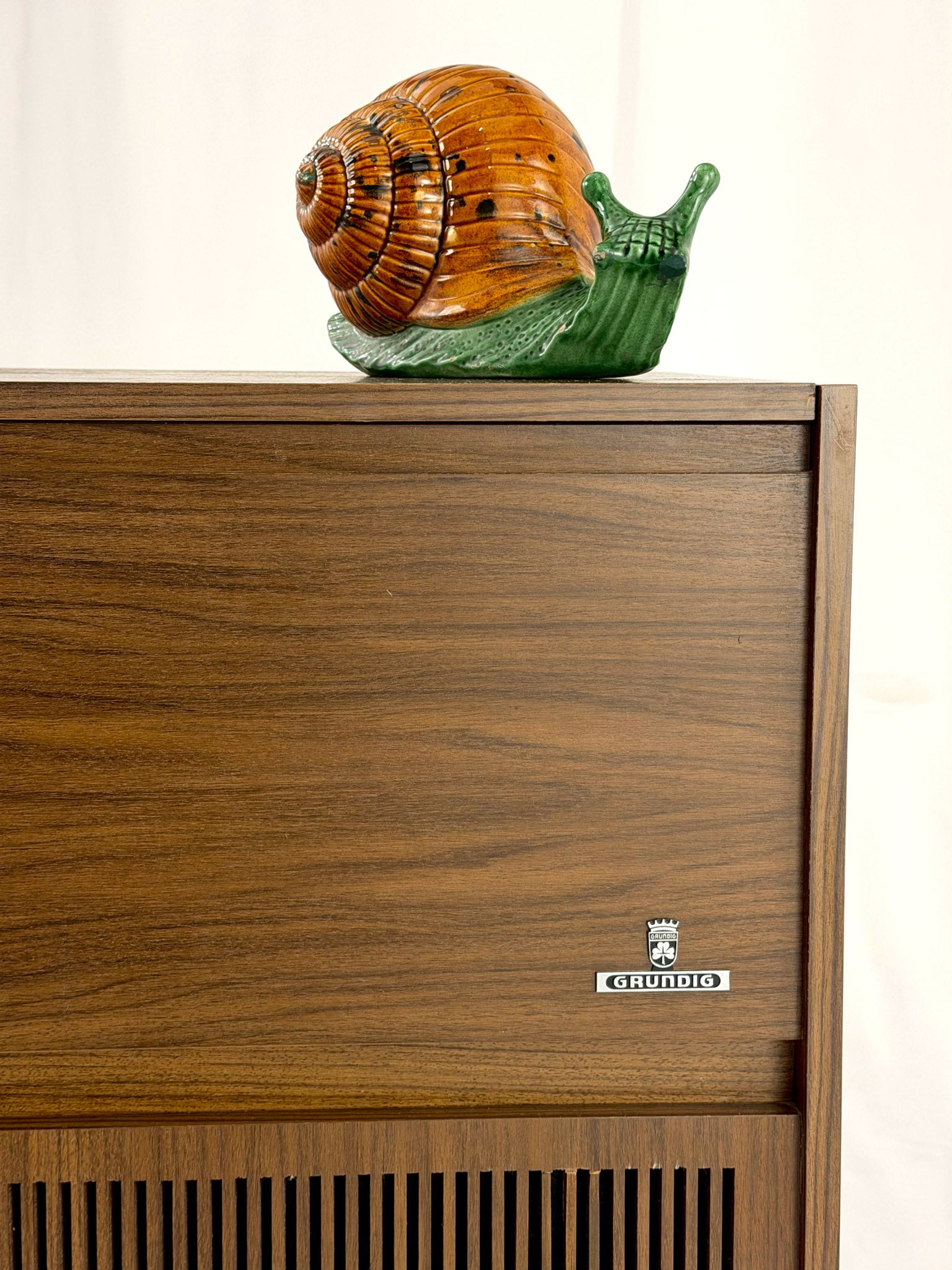Vintage wooden stereo console on a white background