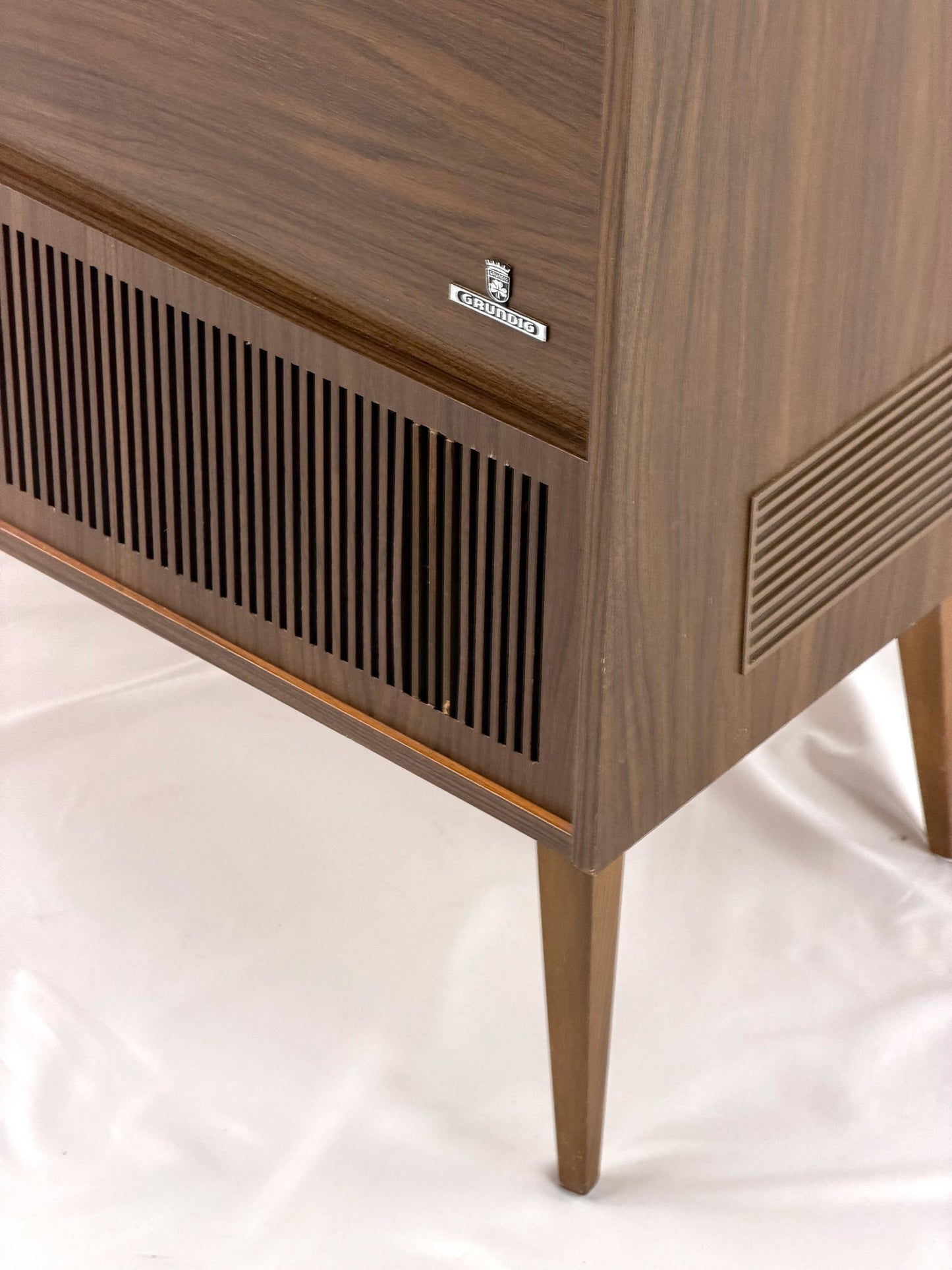 Vintage wooden stereo console on a white background