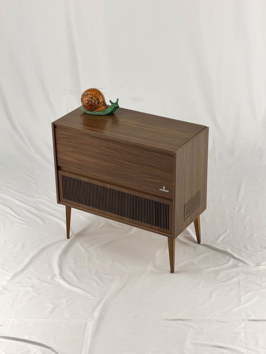 Vintage wooden stereo console on a white background
