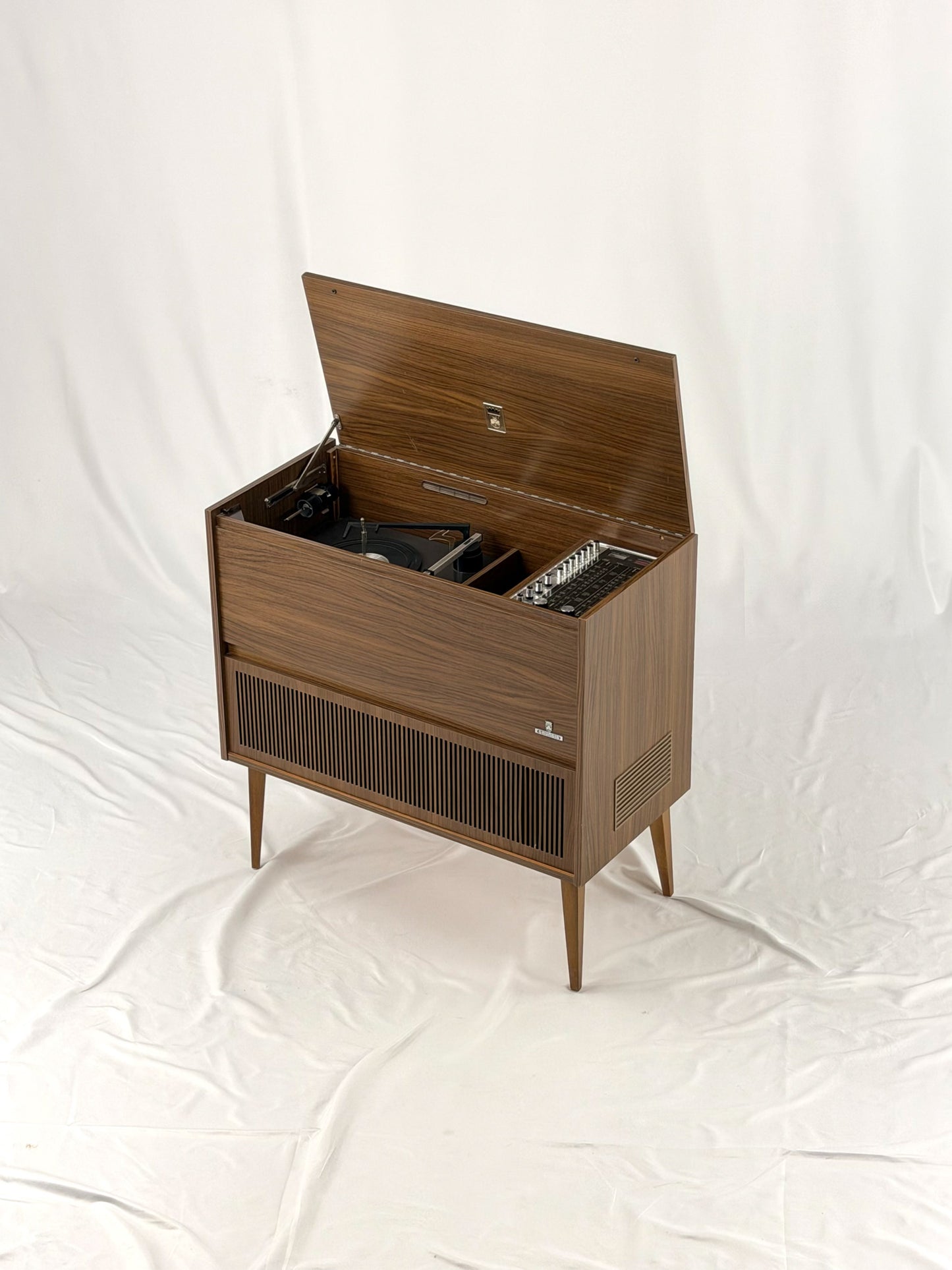 Vintage wooden stereo console on a white background