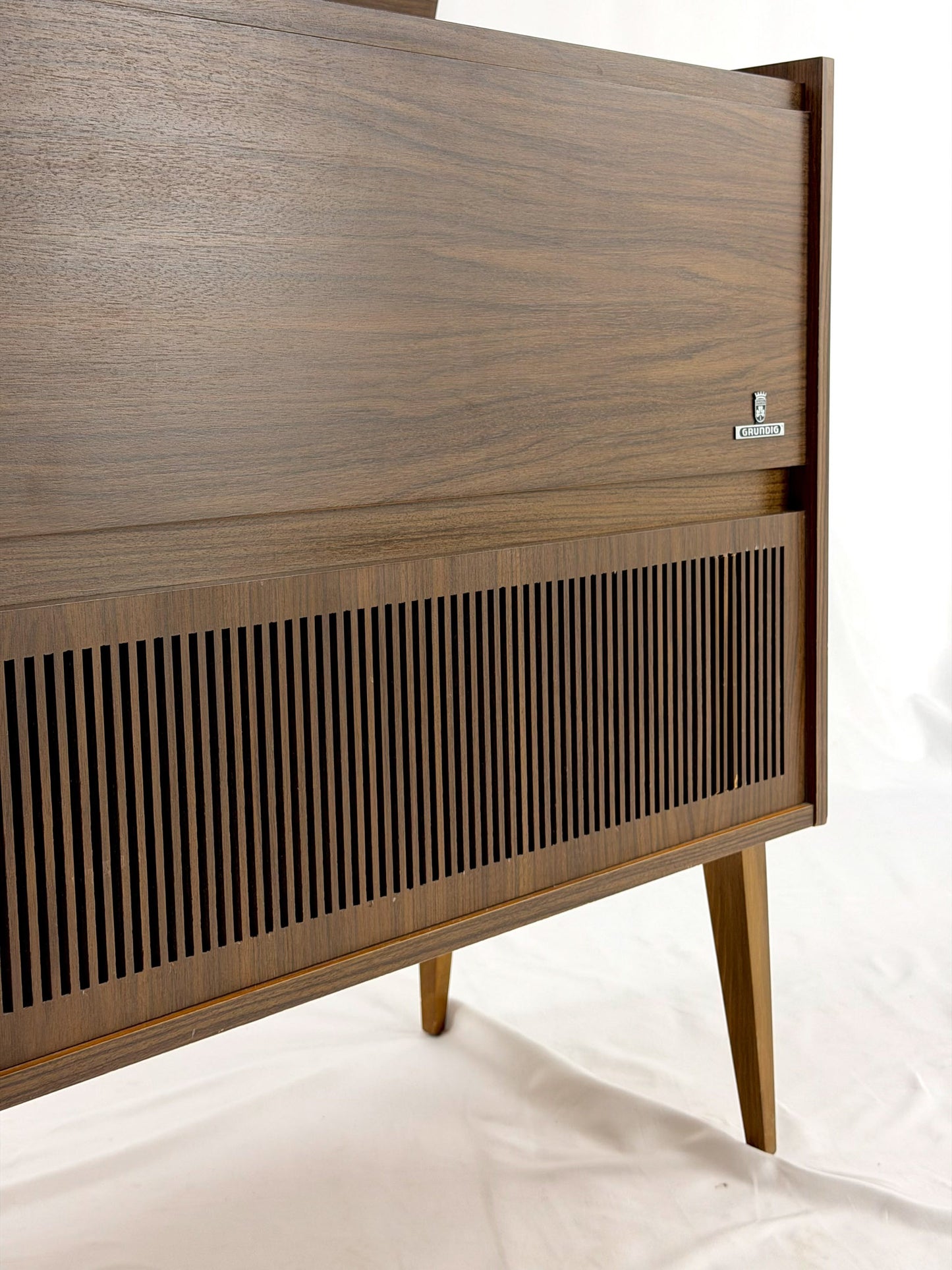 Vintage wooden stereo console on a white background