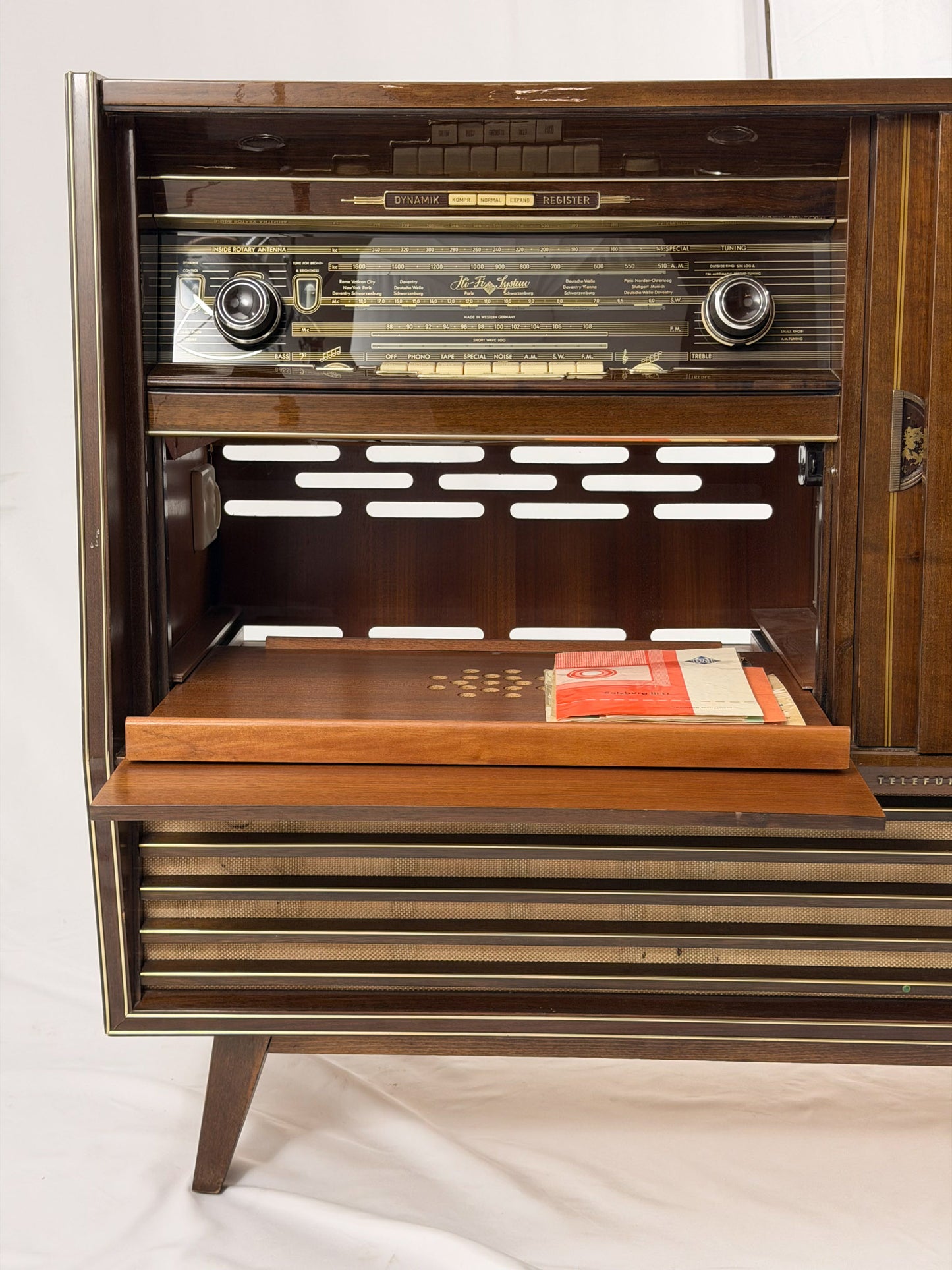 Vintage wooden stereo console on a white background