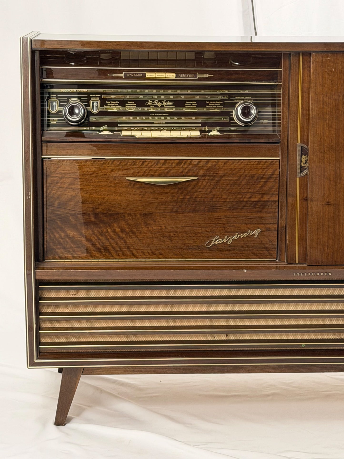 Vintage wooden stereo console on a white background
