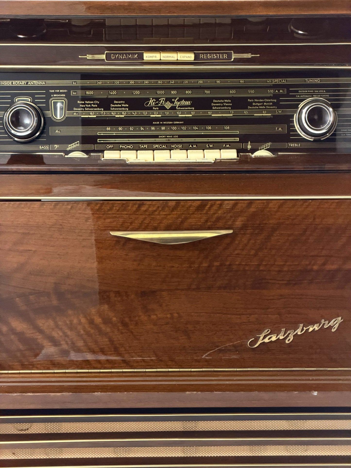 Vintage wooden stereo console on a white background