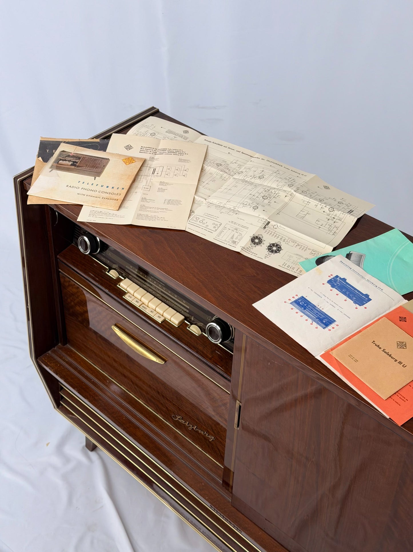 Vintage wooden stereo console on a white background