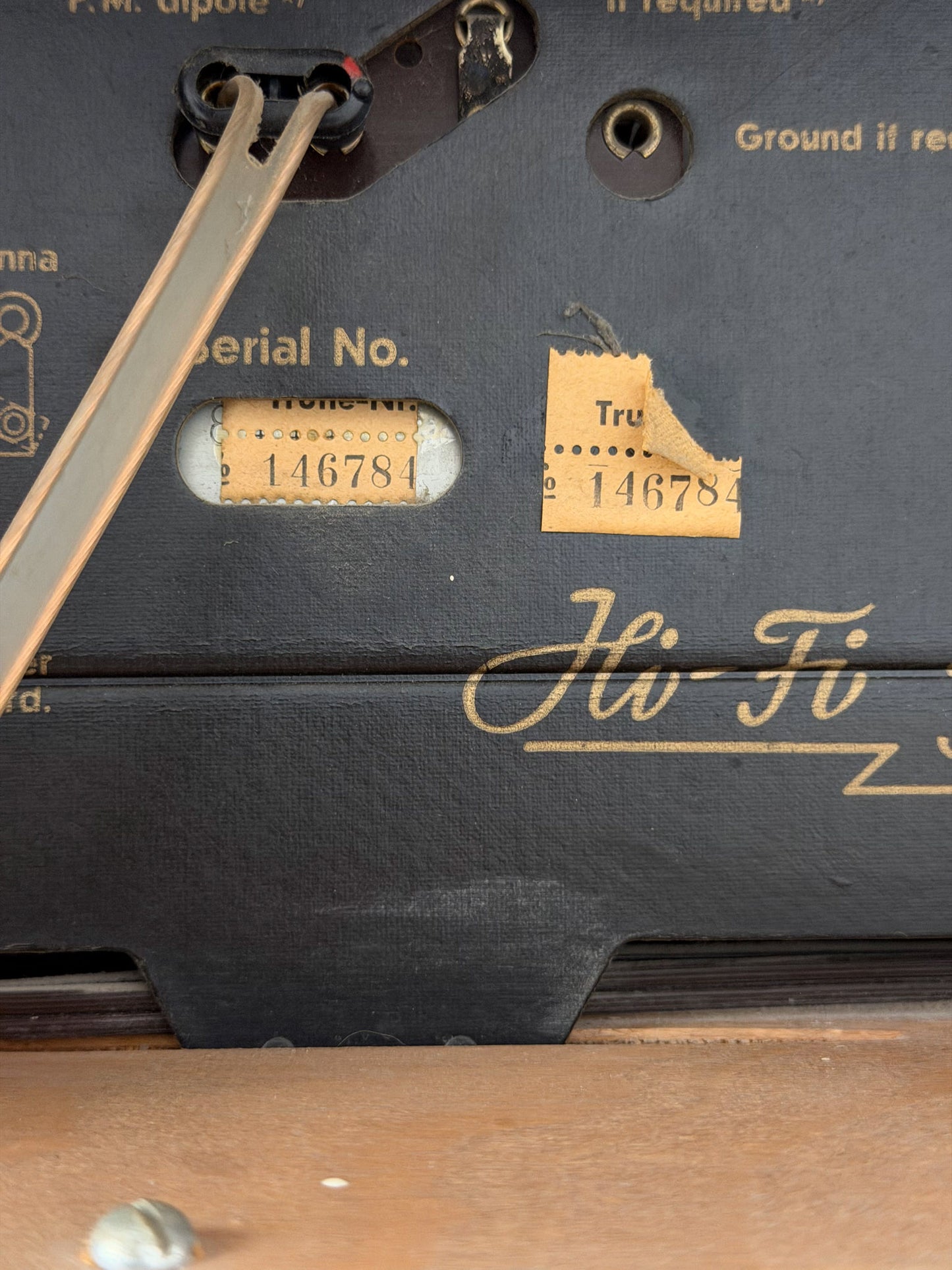 Close-up of a vintage electronic device with 'Hi-Fi' branding and serial number.