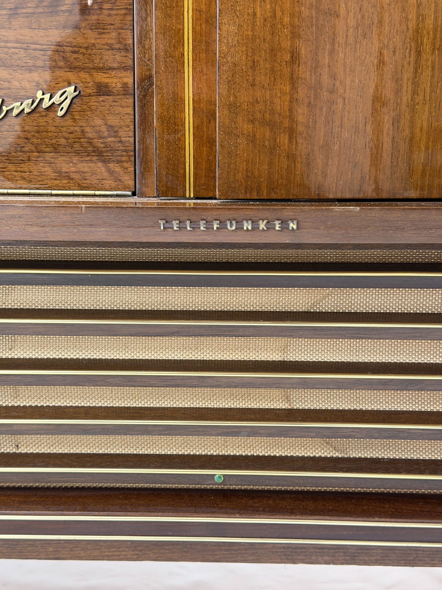 Vintage Telefunken radio with wooden finish and 'Burg' branding.