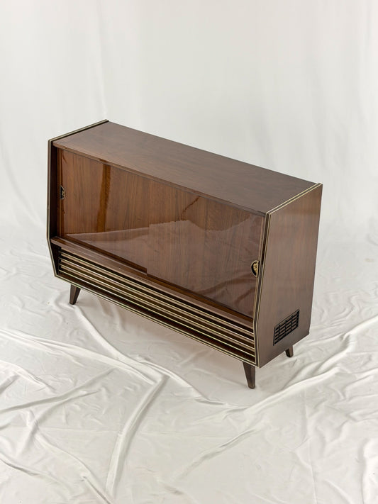 Vintage wooden stereo console on a white background