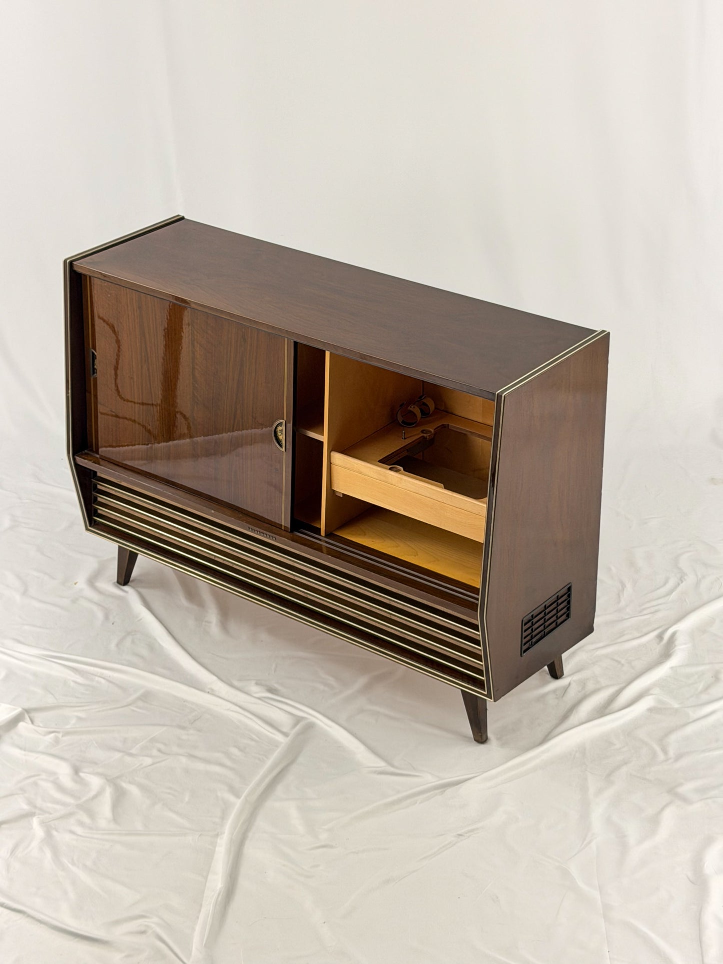 Vintage wooden stereo console on a white background