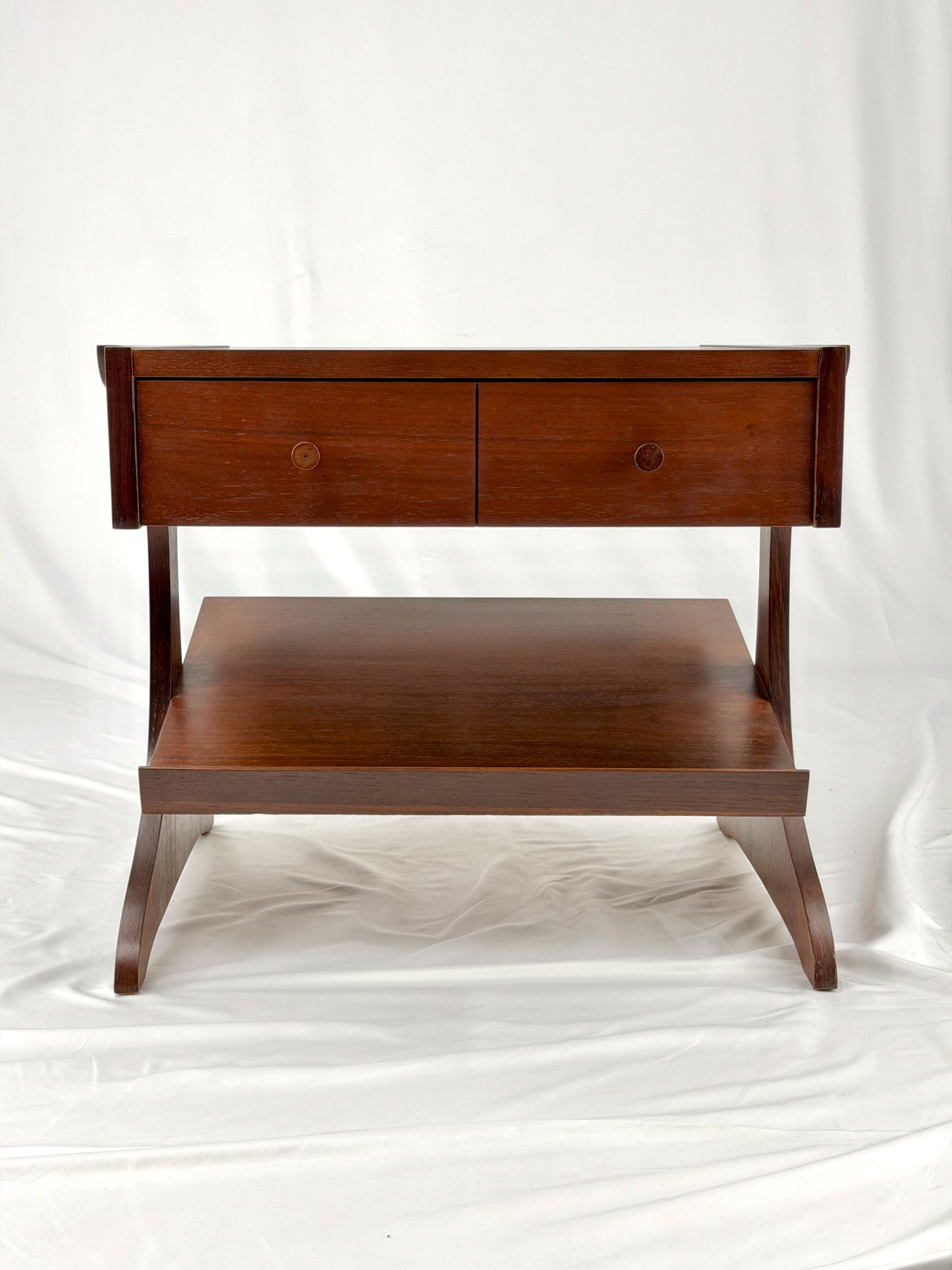 Wooden side table with a unique design on a white background