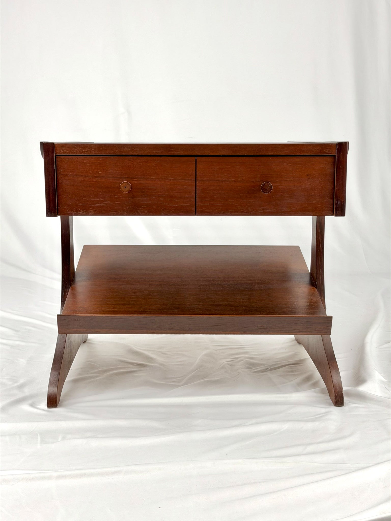 Wooden side table with a unique design on a white background