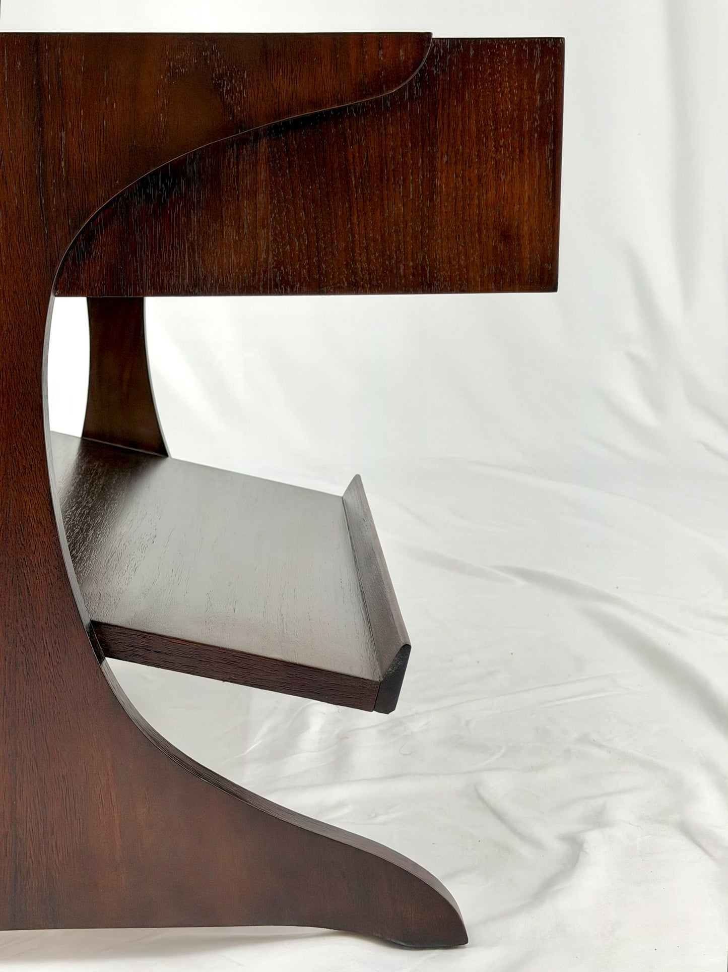 Wooden side table with drawers on a white background