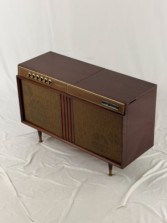 Vintage-style brown audio console on a white background