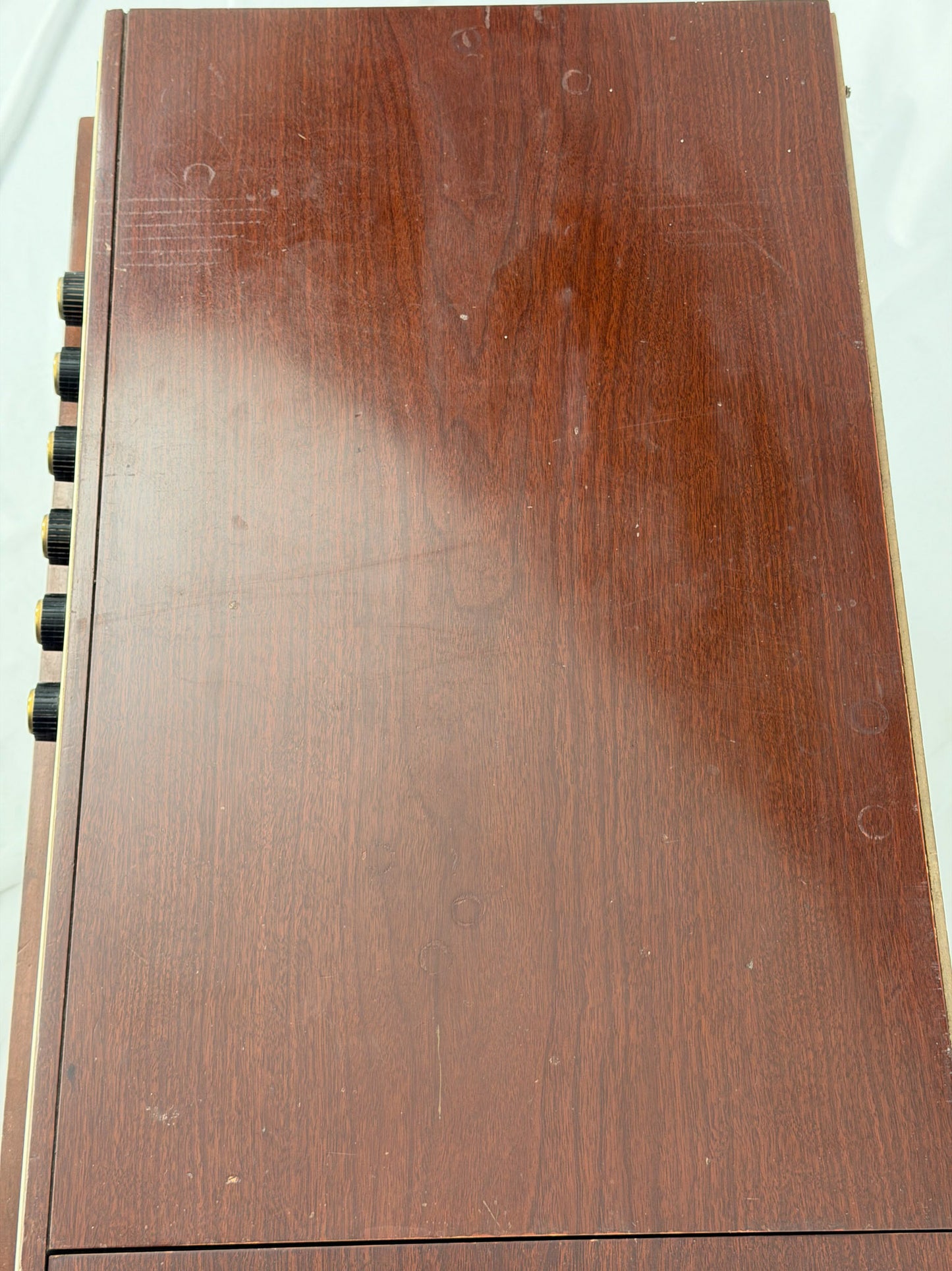 Close-up of a wooden surface with a dark brown stain.