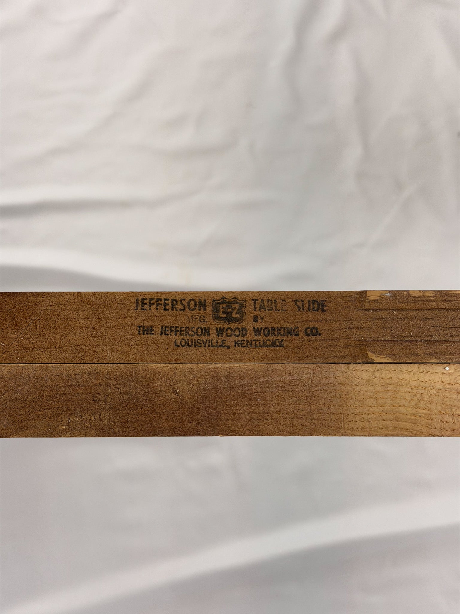 Wooden table slide with 'Jefferson Wood Working Co.' branding on a white background