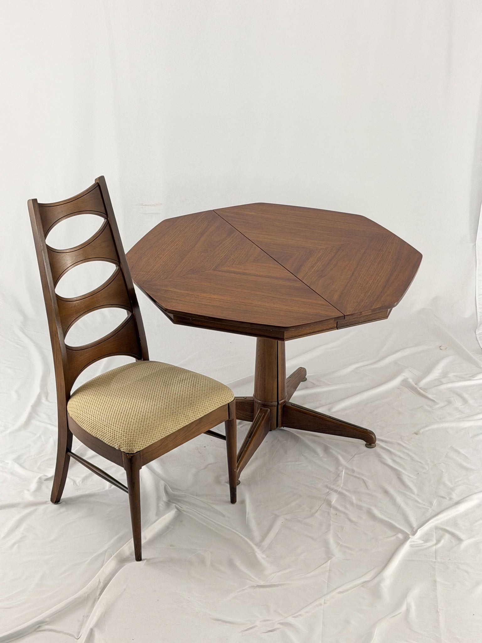 Wooden dining table and chair on a white background