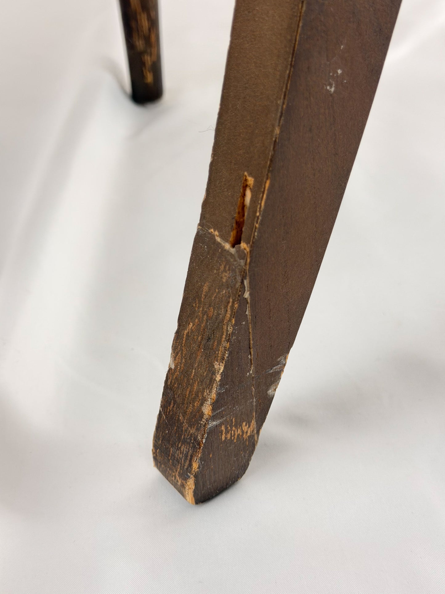 close up Wooden chair with a beige seat on a white background