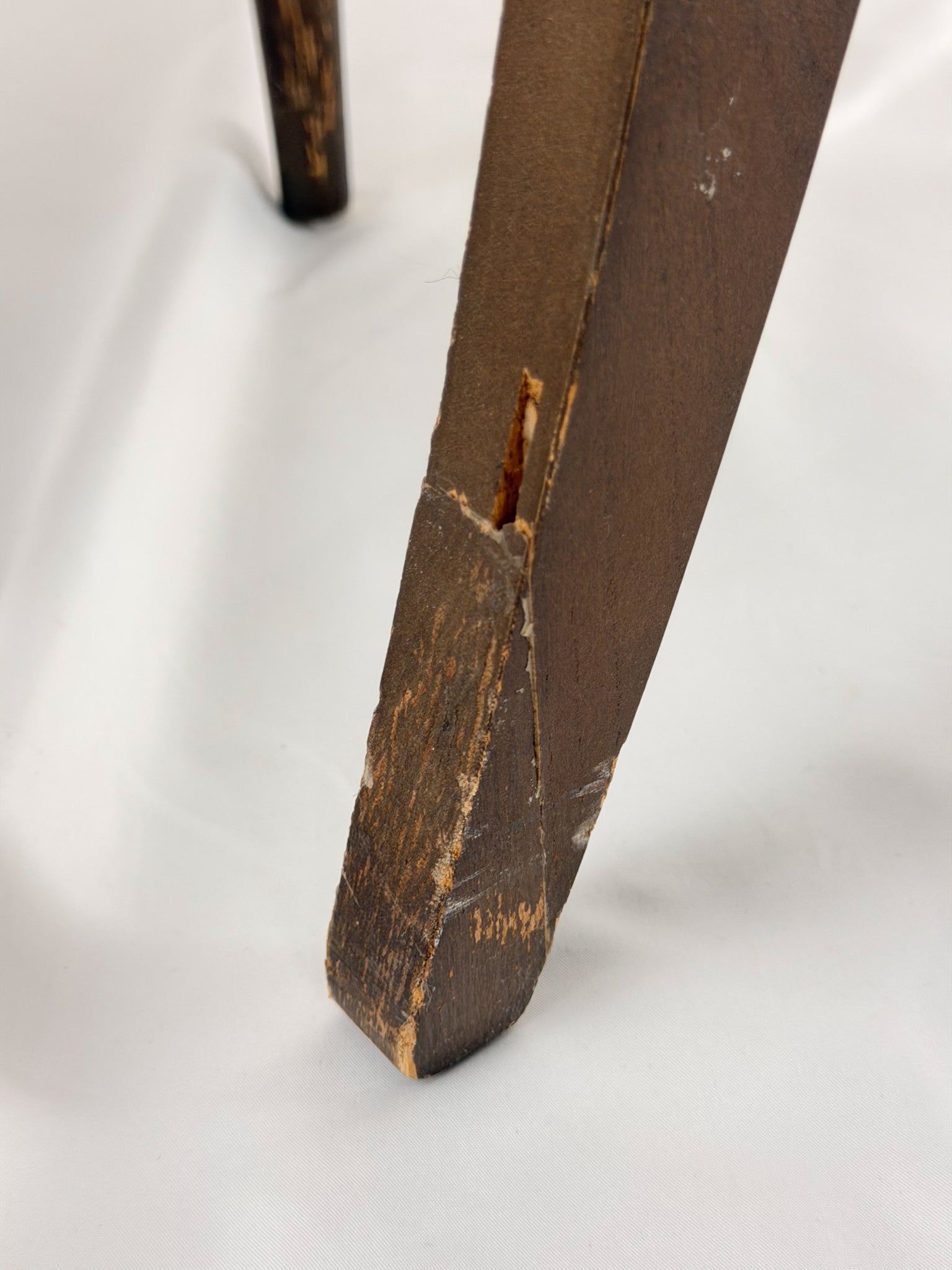 close up Wooden chair with a beige seat on a white background