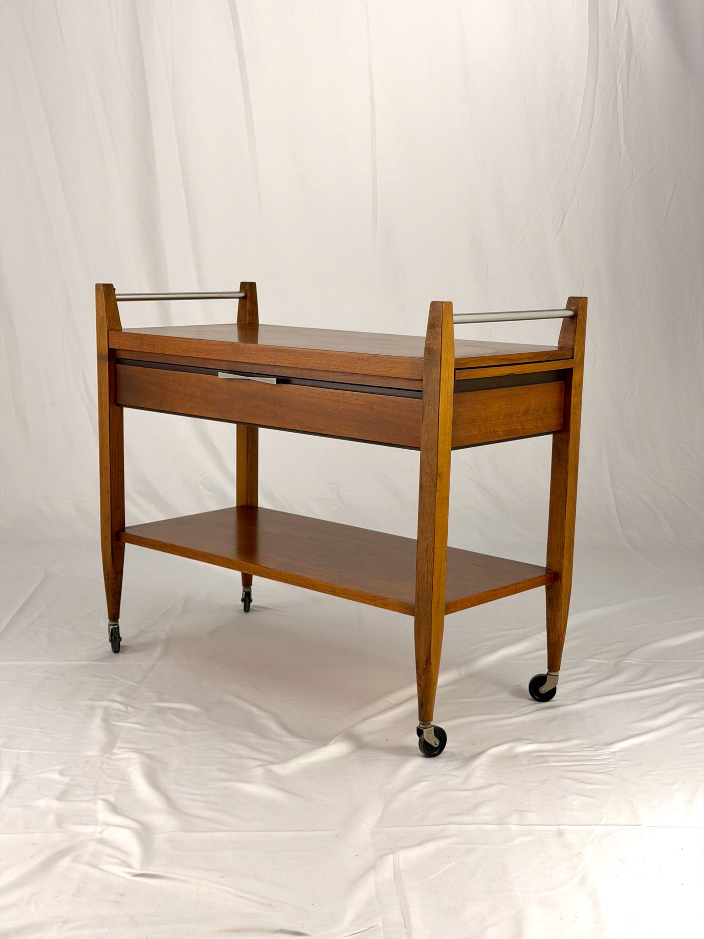 Wooden serving cart on a white background