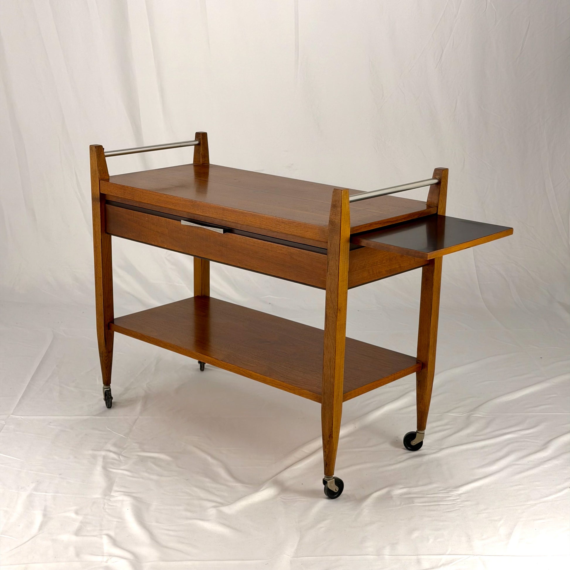 Wooden serving cart with two shelves on a white background