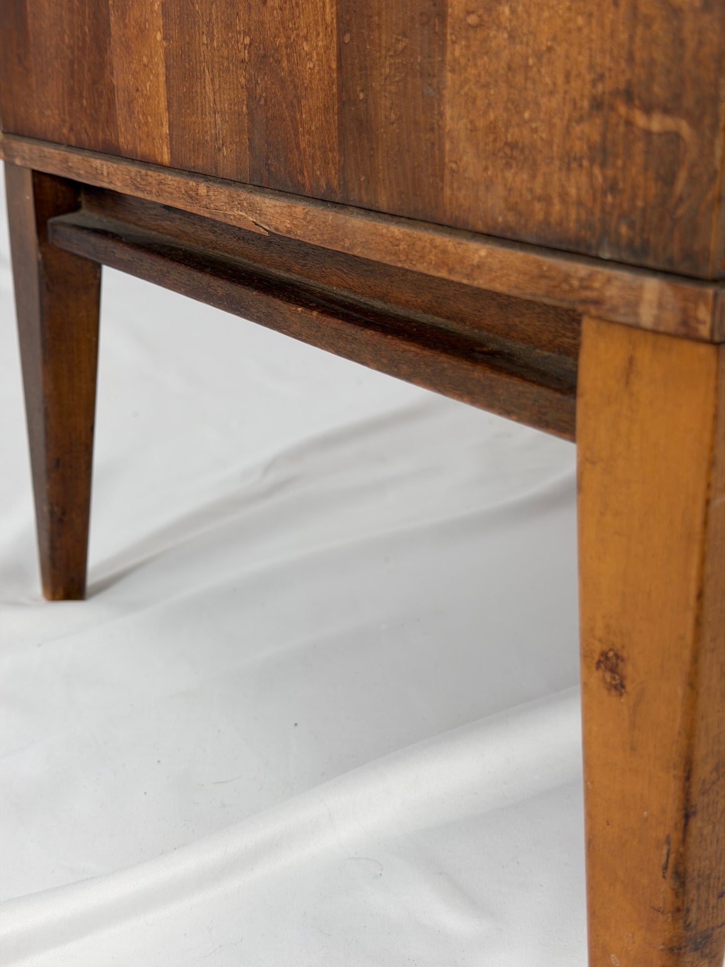 Close-up of a wooden cabinet with a white background
