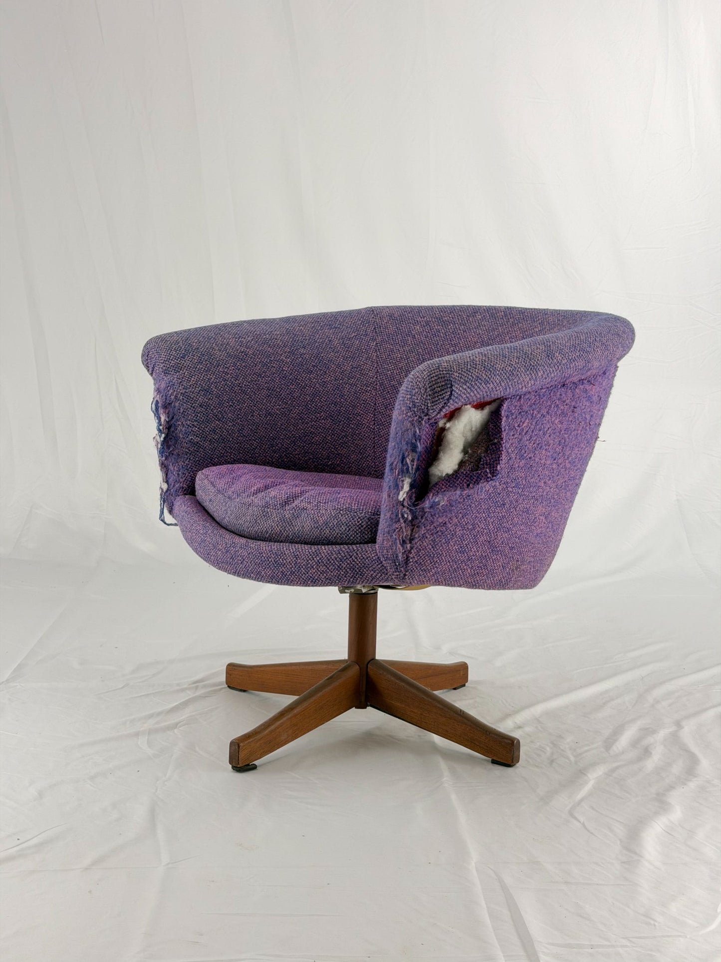 Mid Century Modern Danish pod chair with purple fabric and wooden base with a white background
