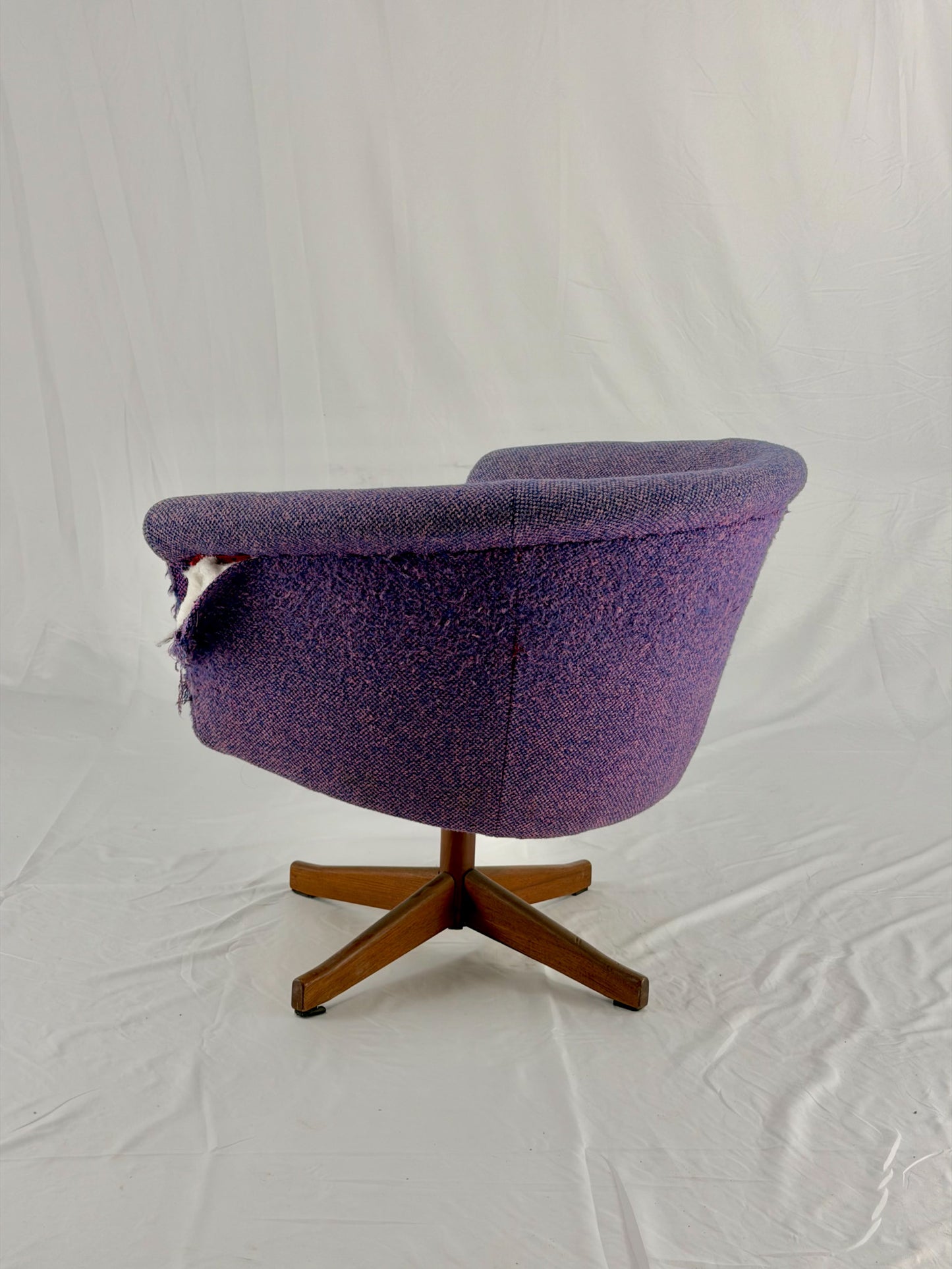 Mid Century Modern Danish pod chair with purple fabric and wooden base with a white background