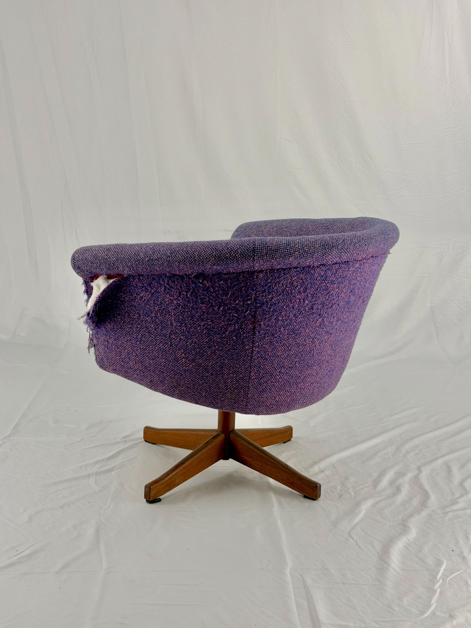 Mid Century Modern Danish pod chair with purple fabric and wooden base with a white background