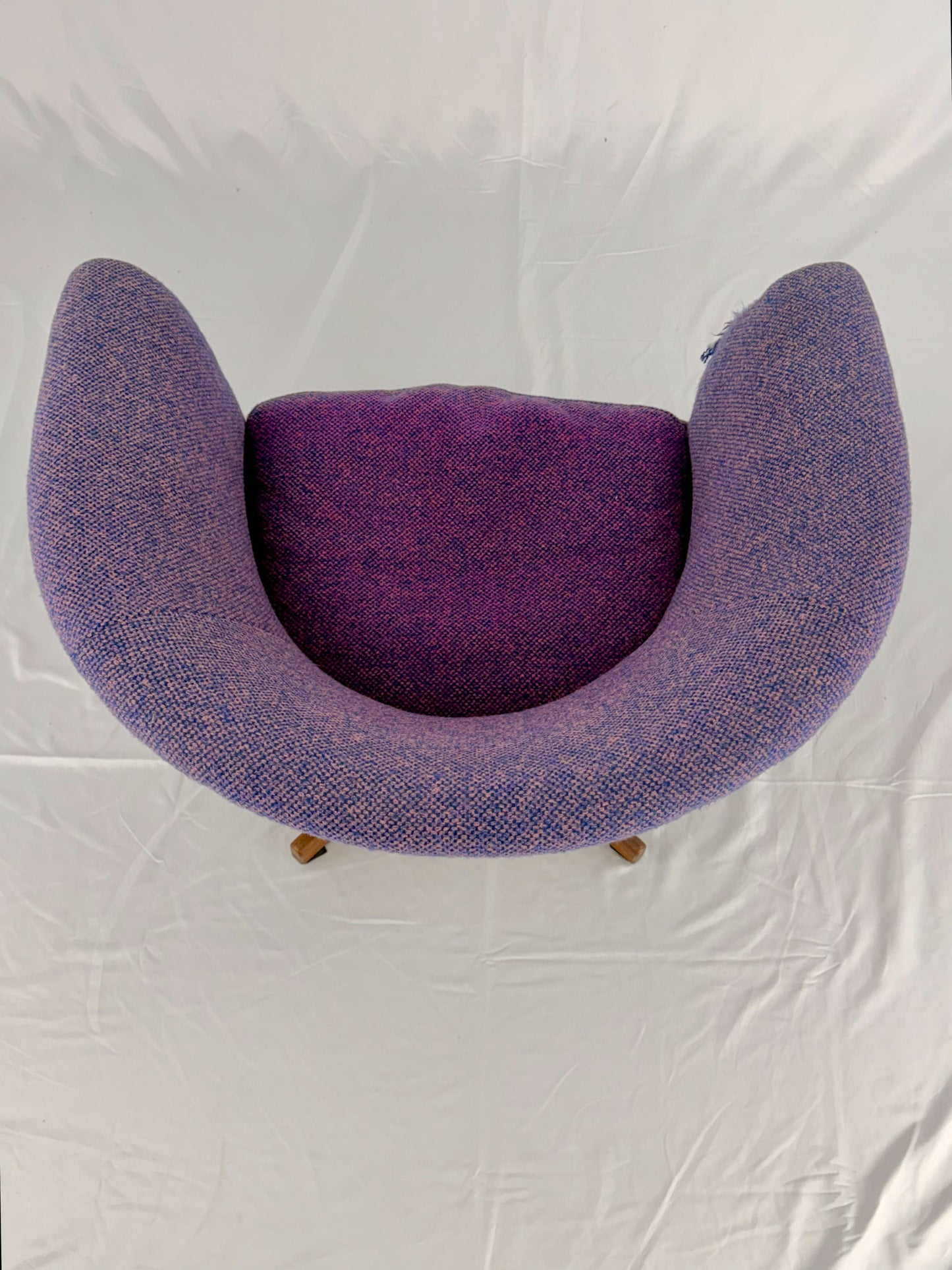 Mid Century Modern Danish pod chair with purple fabric and wooden base with a white background