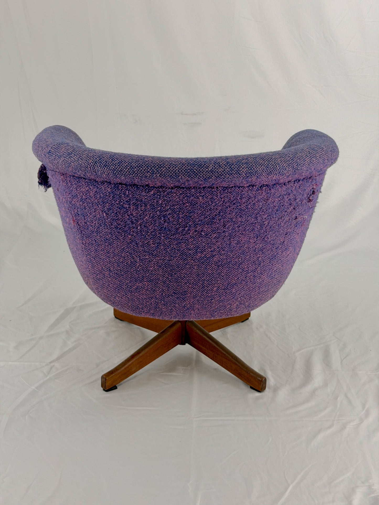 Mid Century Modern Danish pod chair with purple fabric and wooden base with a white background