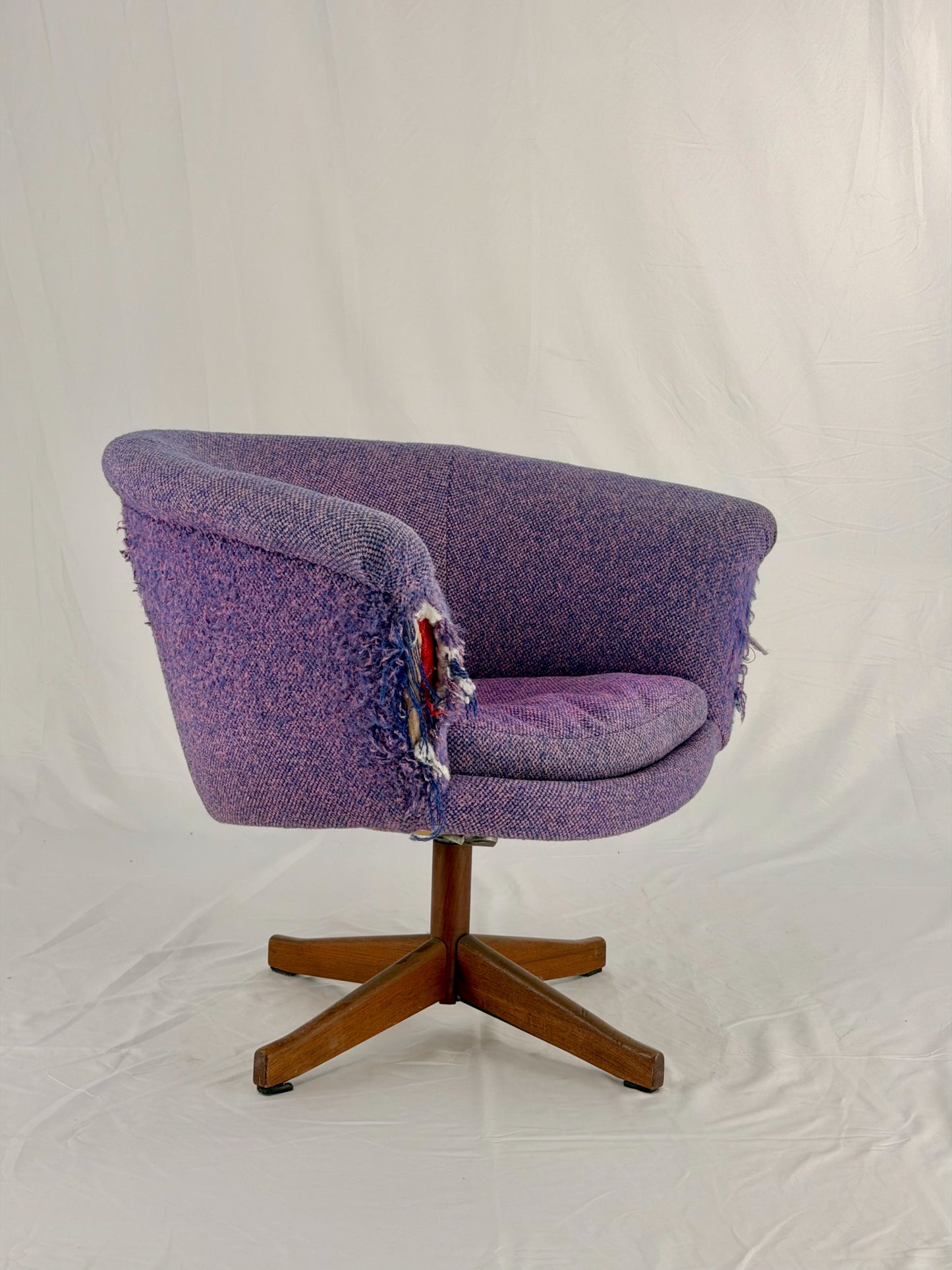 Mid Century Modern Danish pod chair with purple fabric and wooden base with a white background