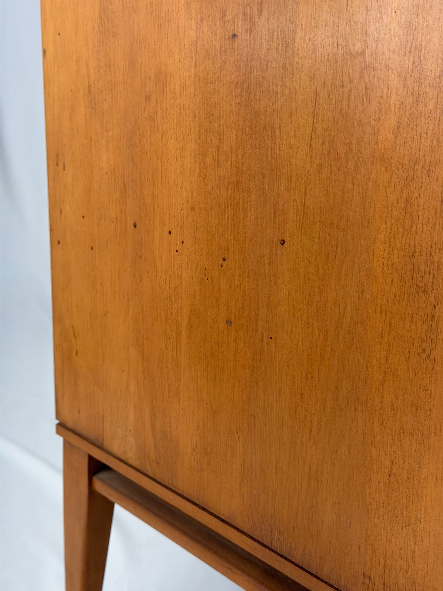Wooden cabinet with a white background