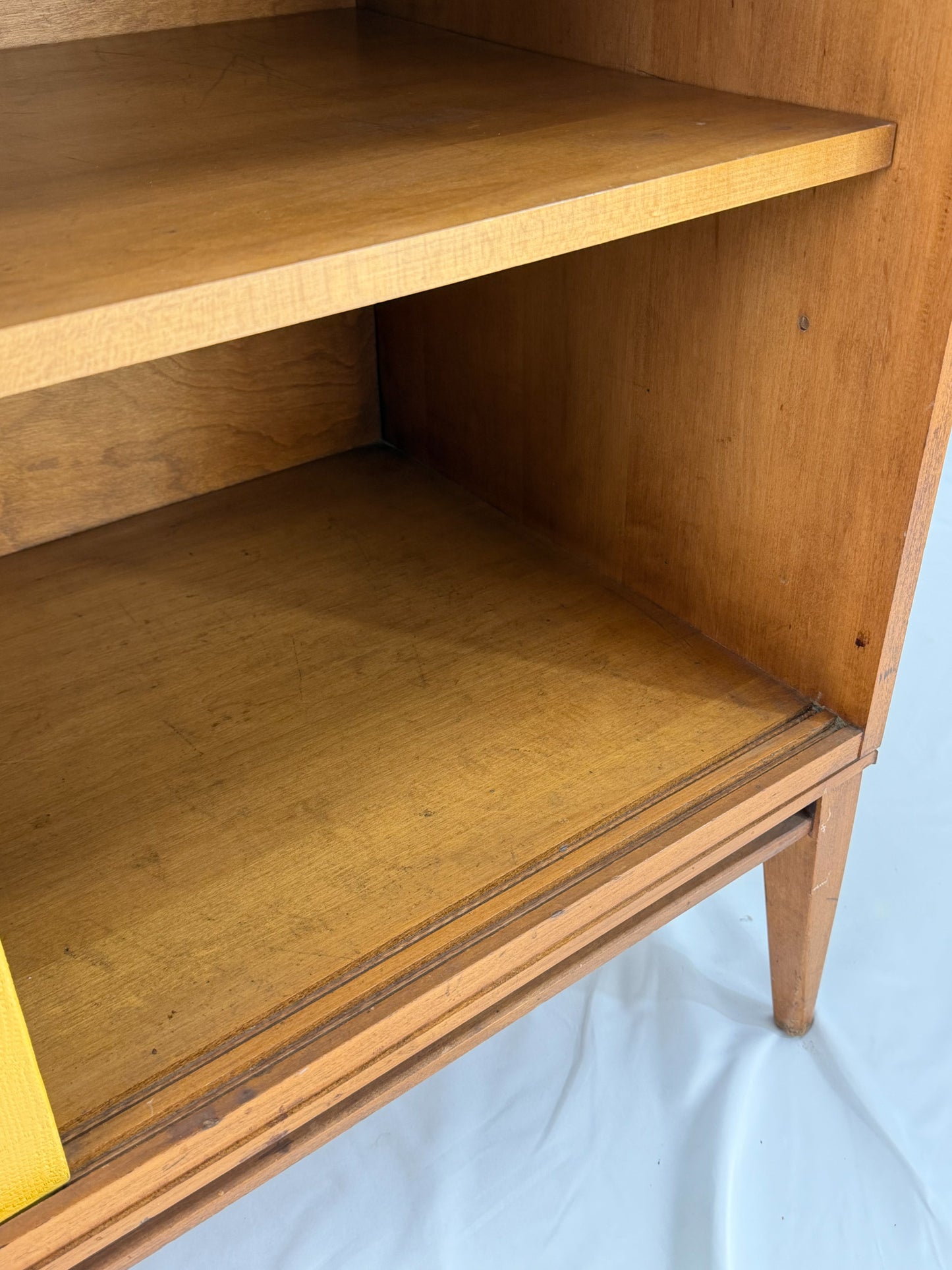 Wooden shelf with two shelves on a white background