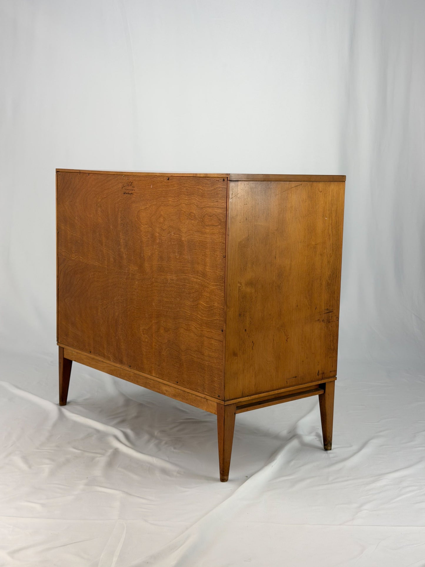 Wooden cabinet with yellow doors on a white background