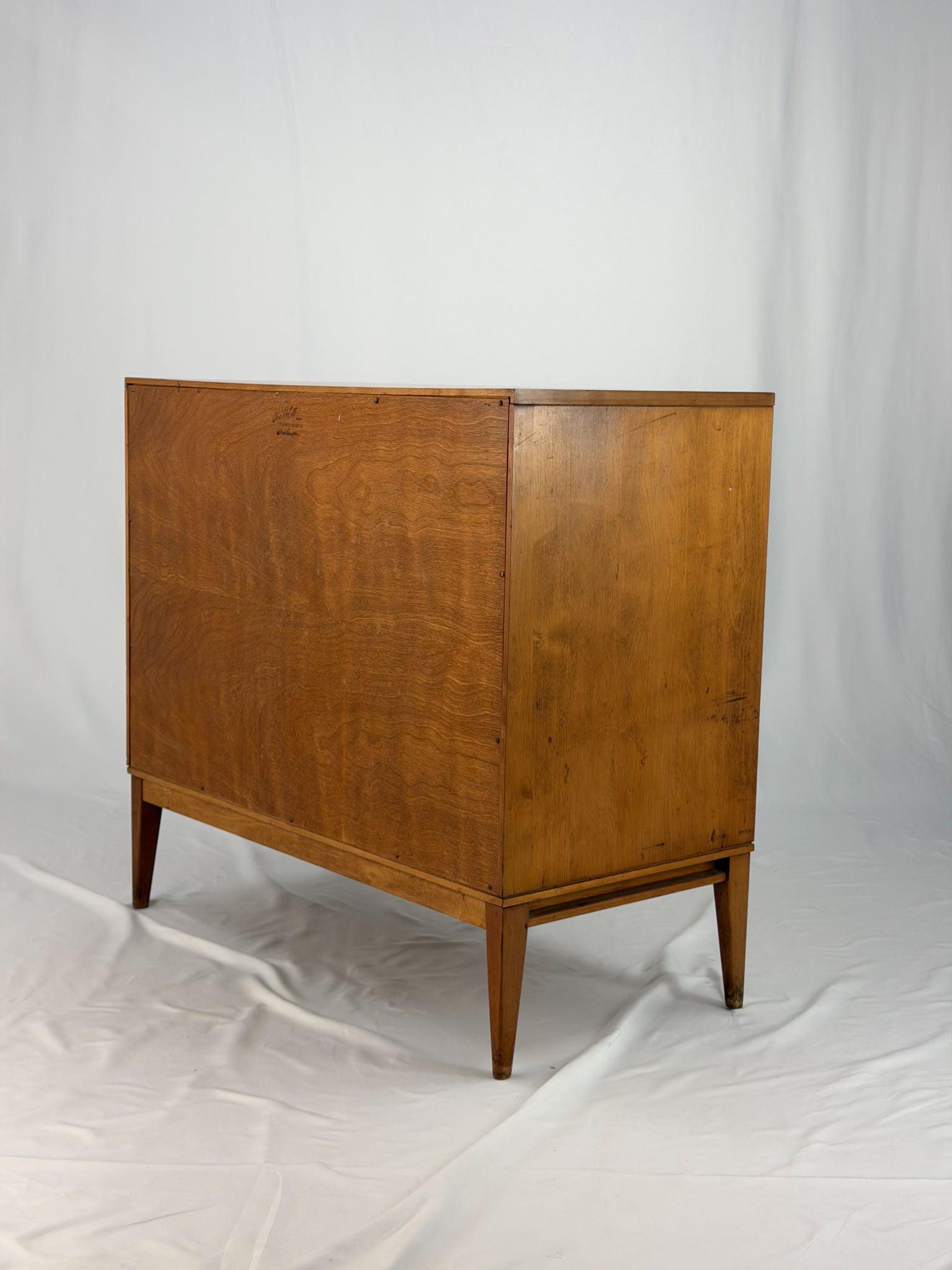 Wooden cabinet with yellow doors on a white background