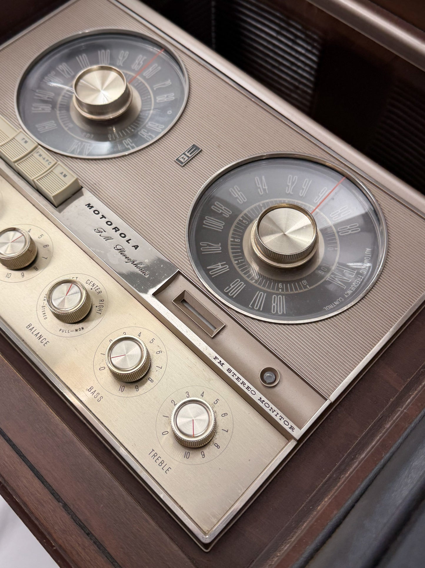 Close-up of a vintage Motorola radio with dials and buttons.