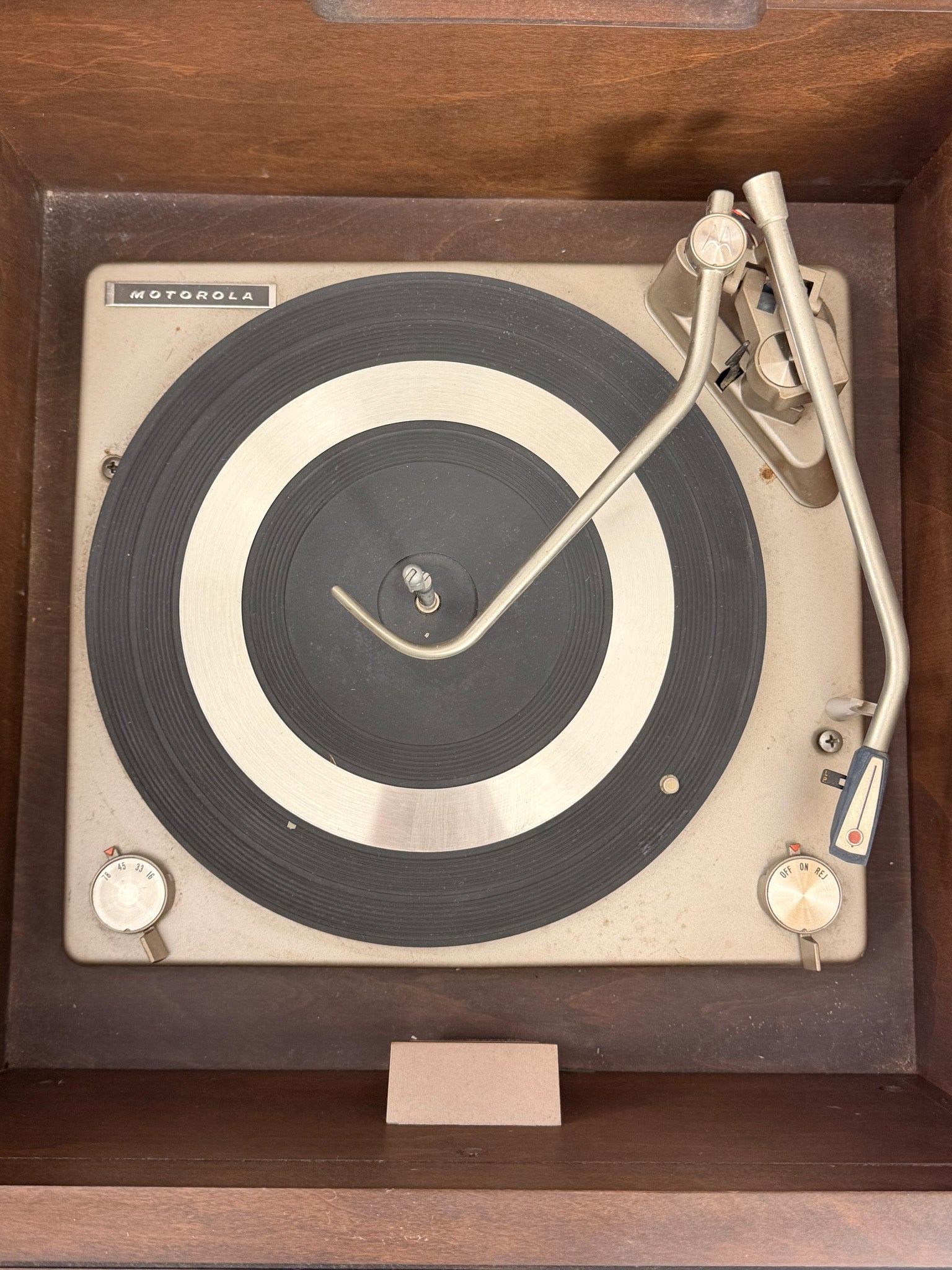 Vintage turntable with 'Motorola' branding on a wooden surface