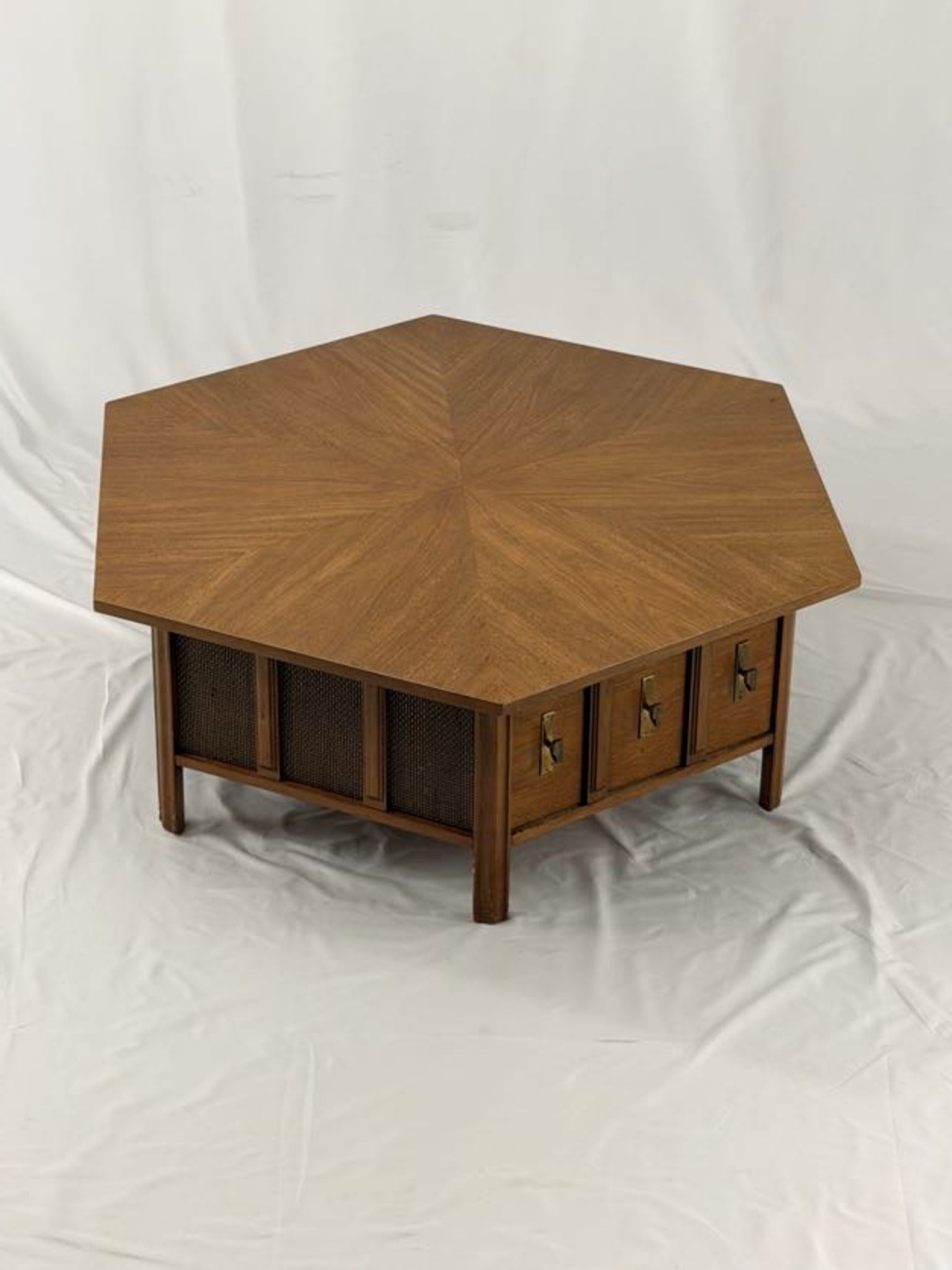 Wooden hexagonal table with a drawer open, on a white background