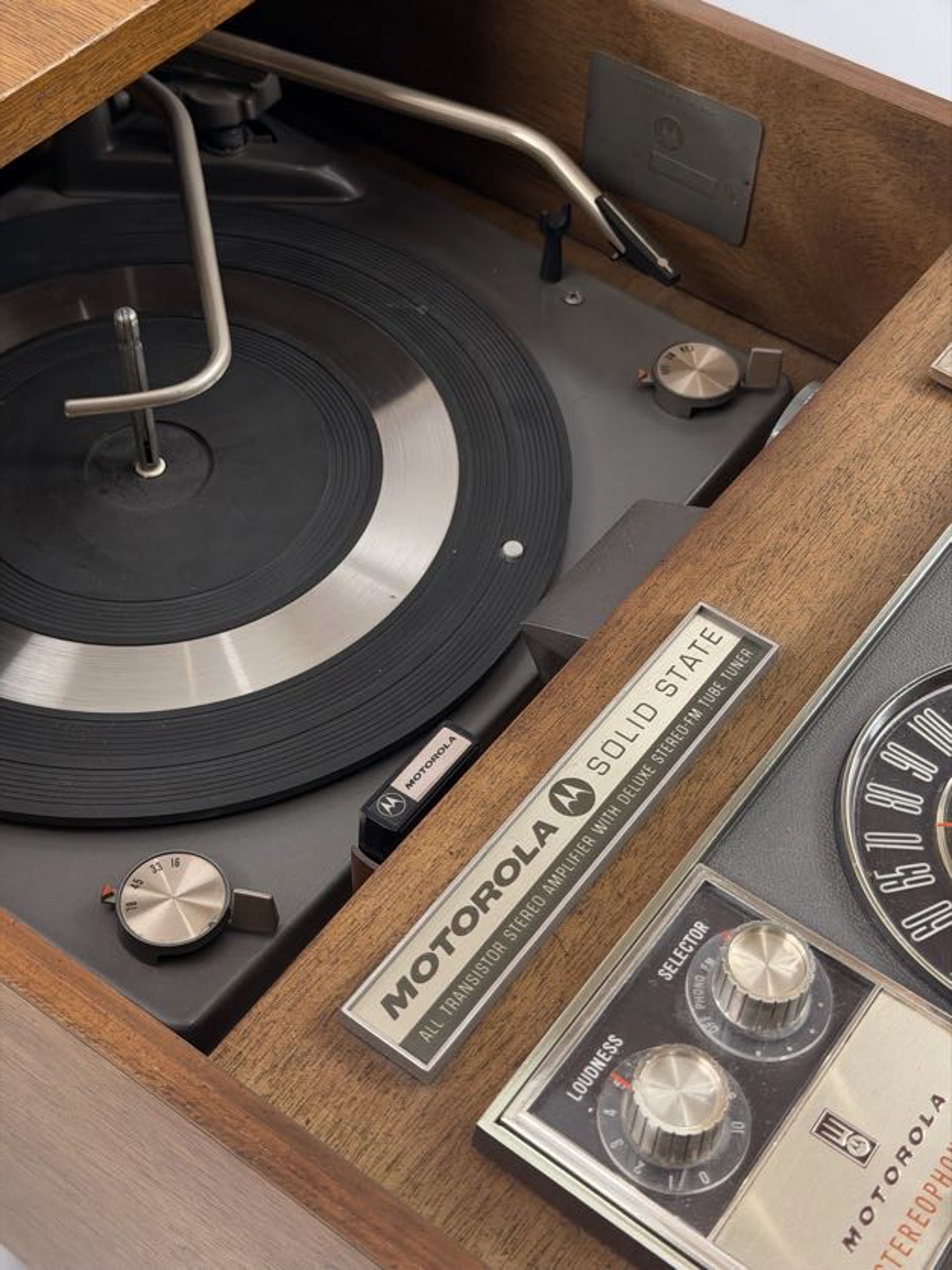 Close-up of a vintage record player with 'Motorola' branding.
