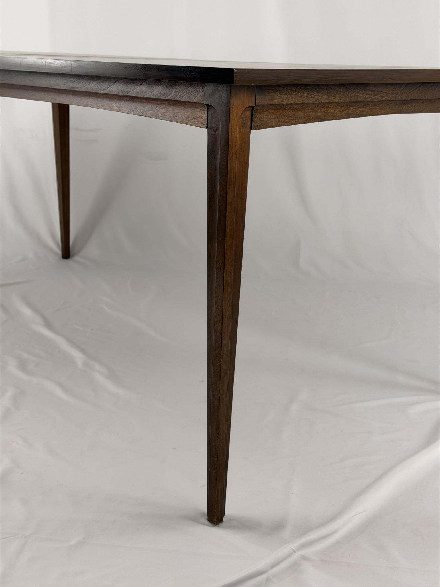 Wooden table leg on a white background