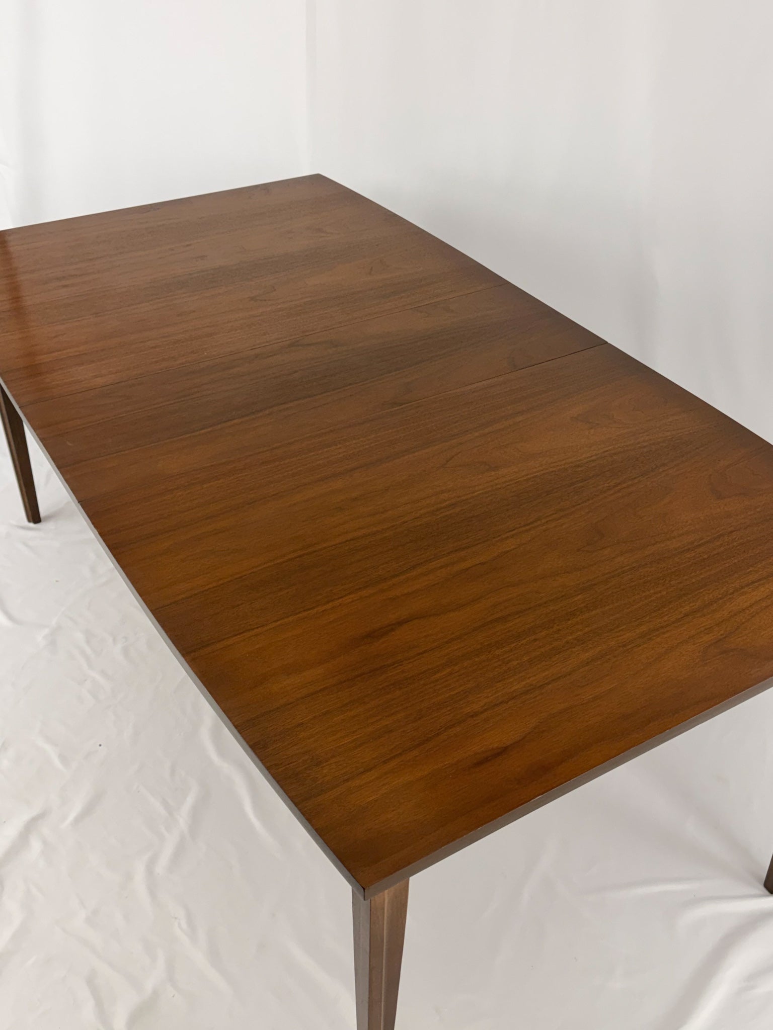 Wooden dining table on a white background