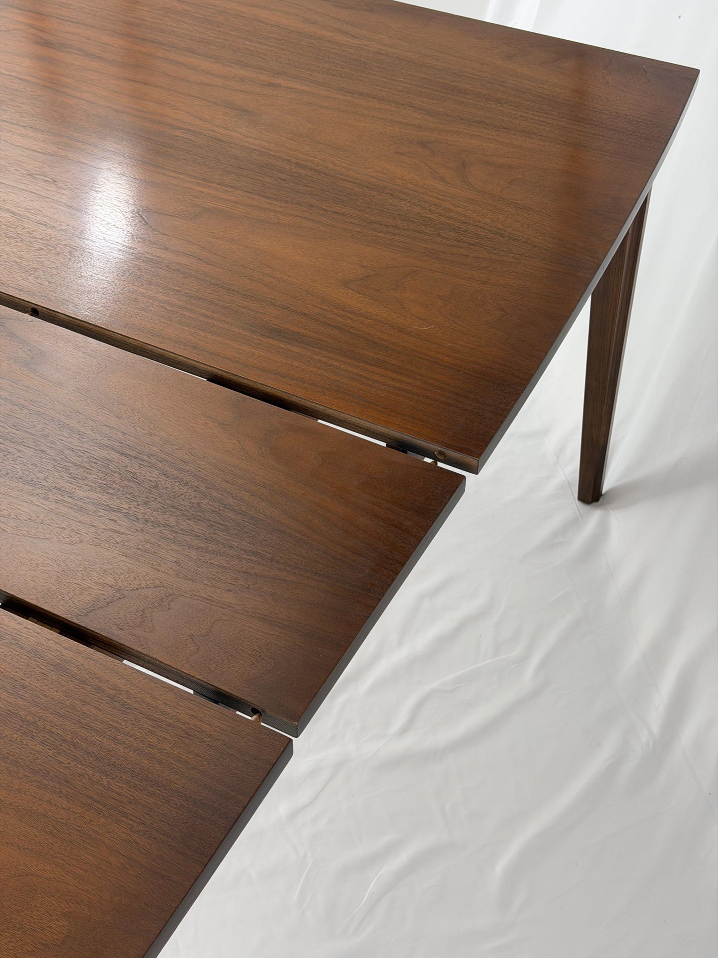 Wooden dining table with a white background